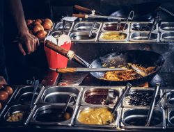 cook-is-fry-vegetables-with-spices-sauce-wok-cooking-process-asian-restaurant